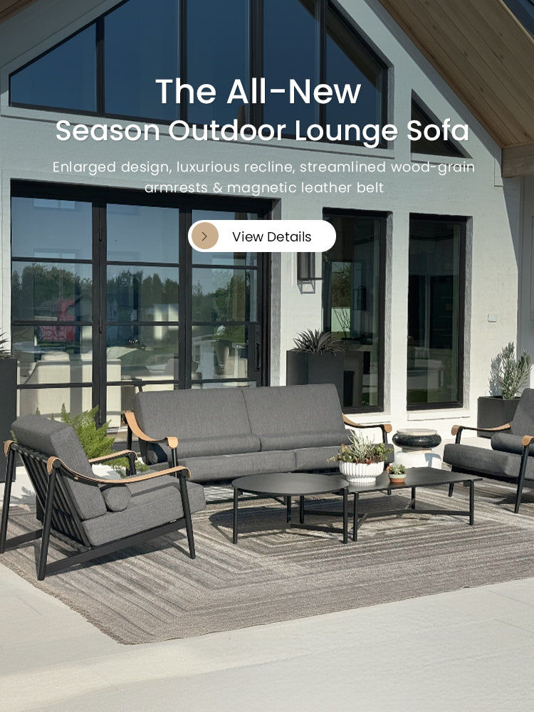 Outdoor lounge sofa set on a patio with a modern house in the background