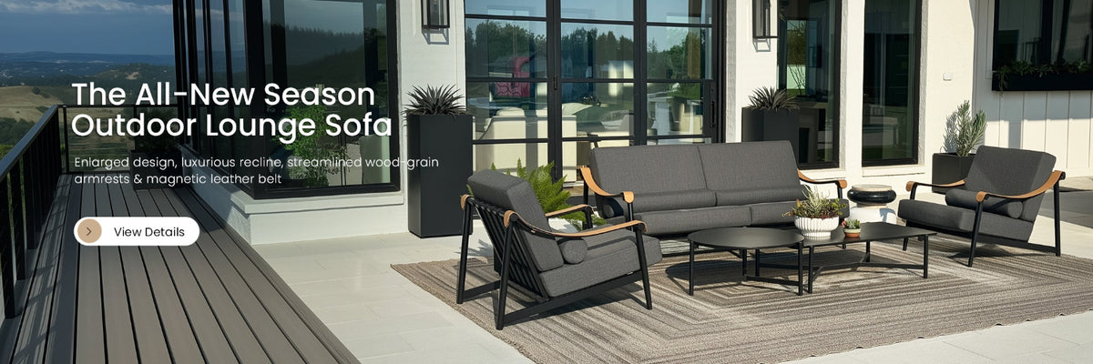 Outdoor lounge sofa set on a patio with modern building in the background