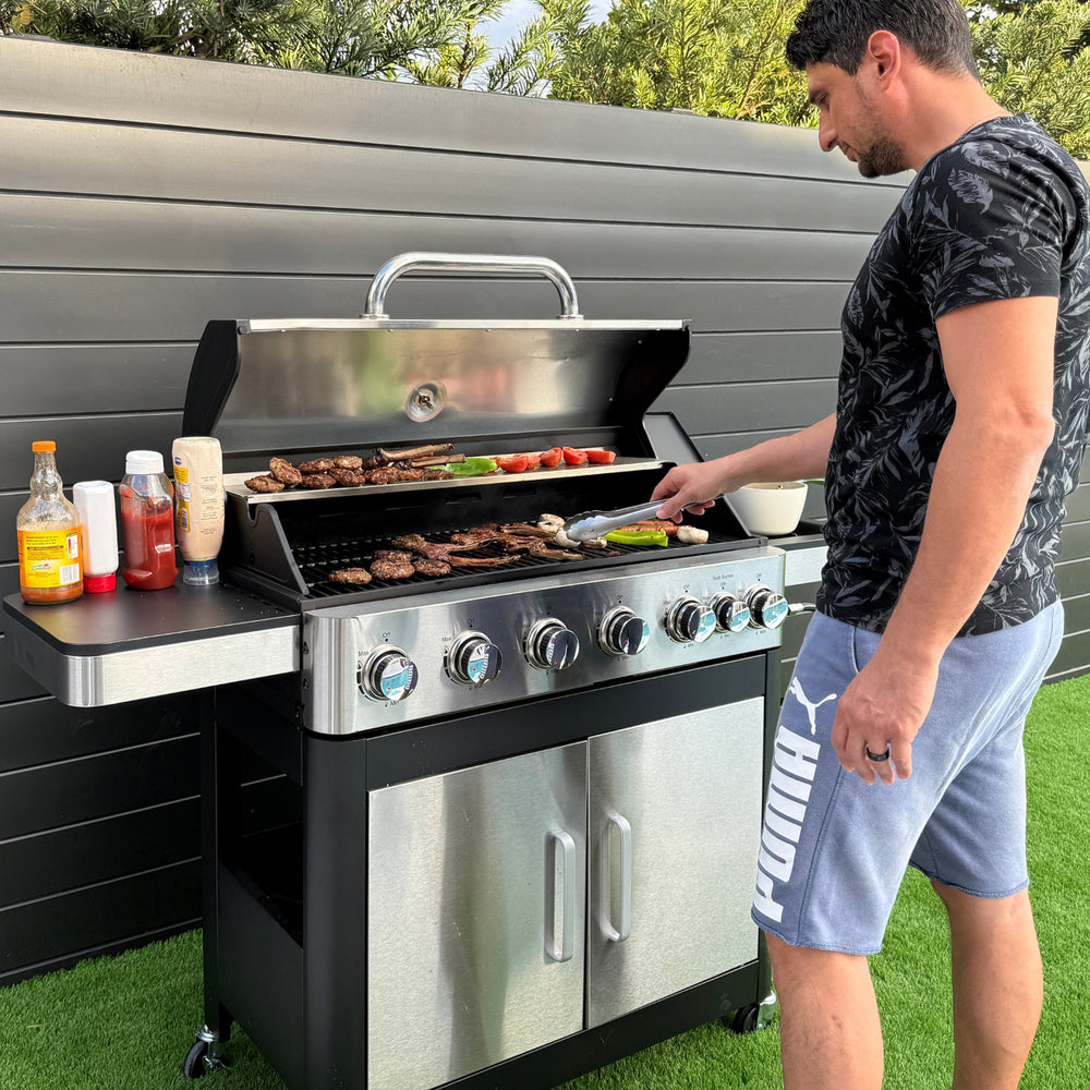 A silver 6-burner gas BBQ patio grill with a side burner, perfect for grilling food.