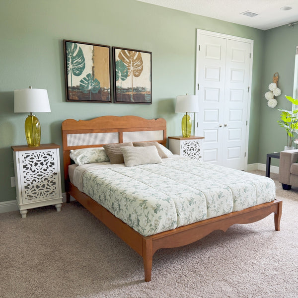 Bedroom with wooden bed, nightstands, and decorative elements.
