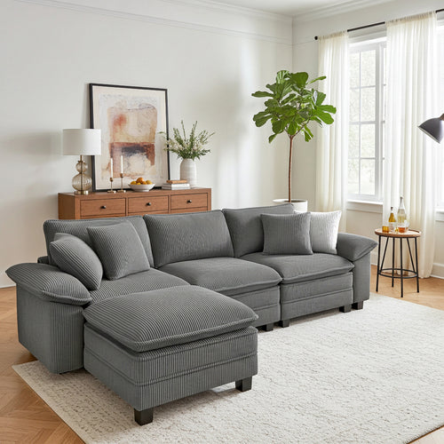 Gray sectional sofa in a living room with decor elements.