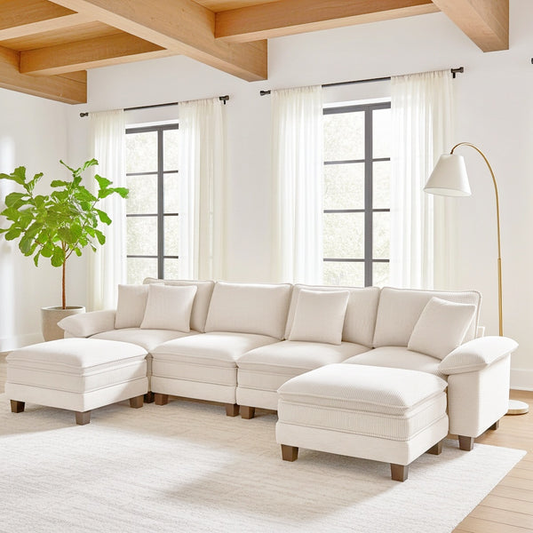 Cozy living room with a large sectional sofa, and decorated walls.