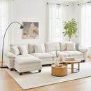Modern living room with a white sectional sofa, wooden coffee table, and decorative elements.