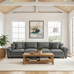 Gray sectional sofa in a living room with a wooden coffee table and decor