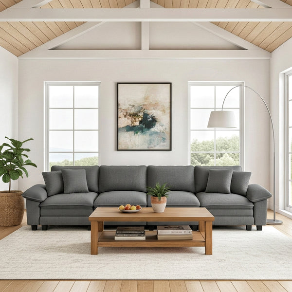 Gray sectional sofa in a living room with a wooden coffee table and decor