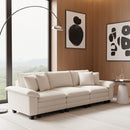 Beige sofa in a modern living room with abstract art on the wall.