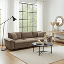 Modern living room with a brown sectional sofa, round coffee table, and decorative items.