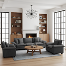 Modern living room with gray sectional sofa, wooden coffee table, and bookshelves.