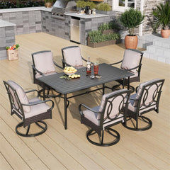 large outdoor dining table and luxurious swivel dining chairs with wicker 