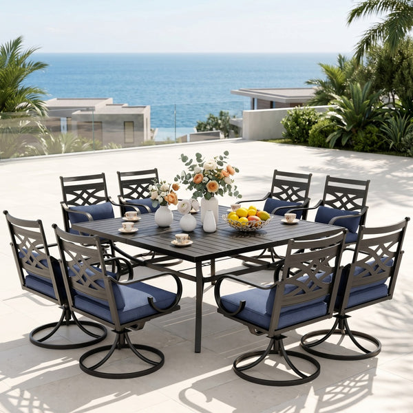 Outdoor dining set with table and chairs on a patio overlooking the ocean.