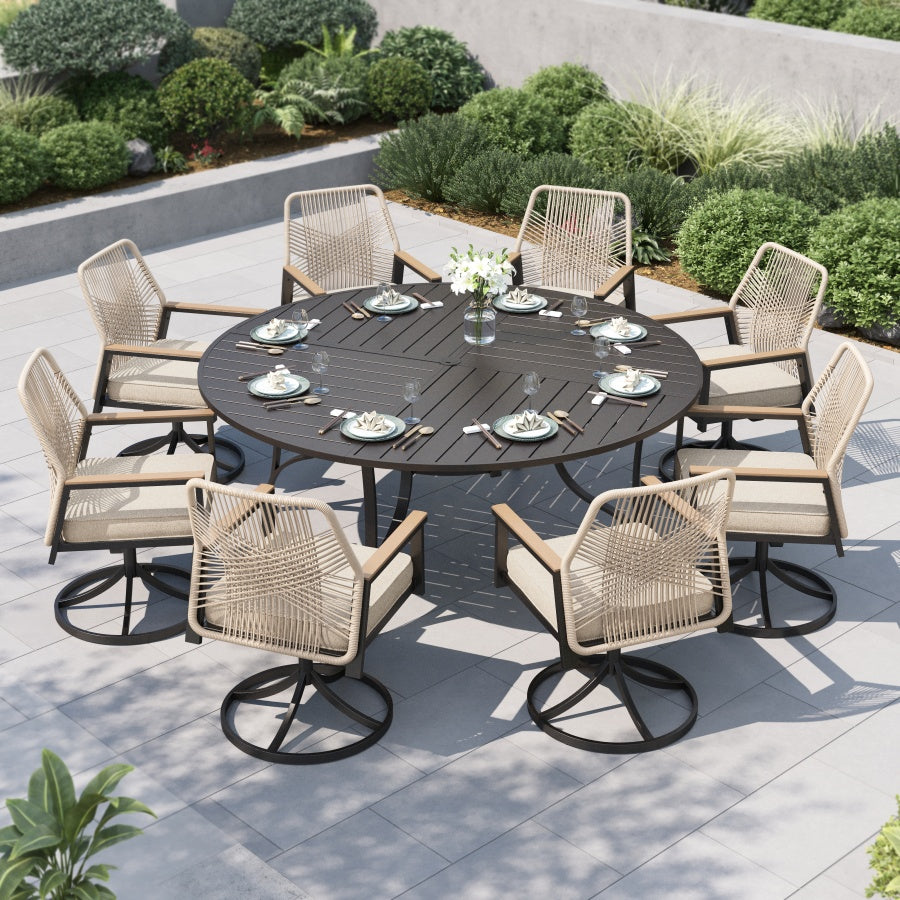 Outdoor dining set with a round table and eight rattan swivel chairs on a patio.