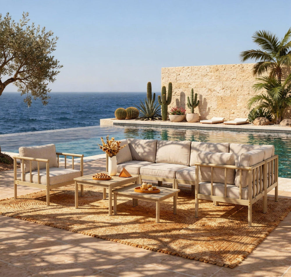 Outdoor patio set with a view of the ocean and pool.