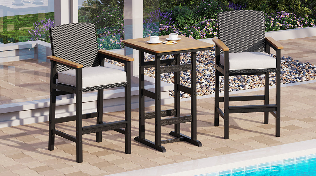 Outdoor patio set with two high chairs and a table on a patio with pool view.